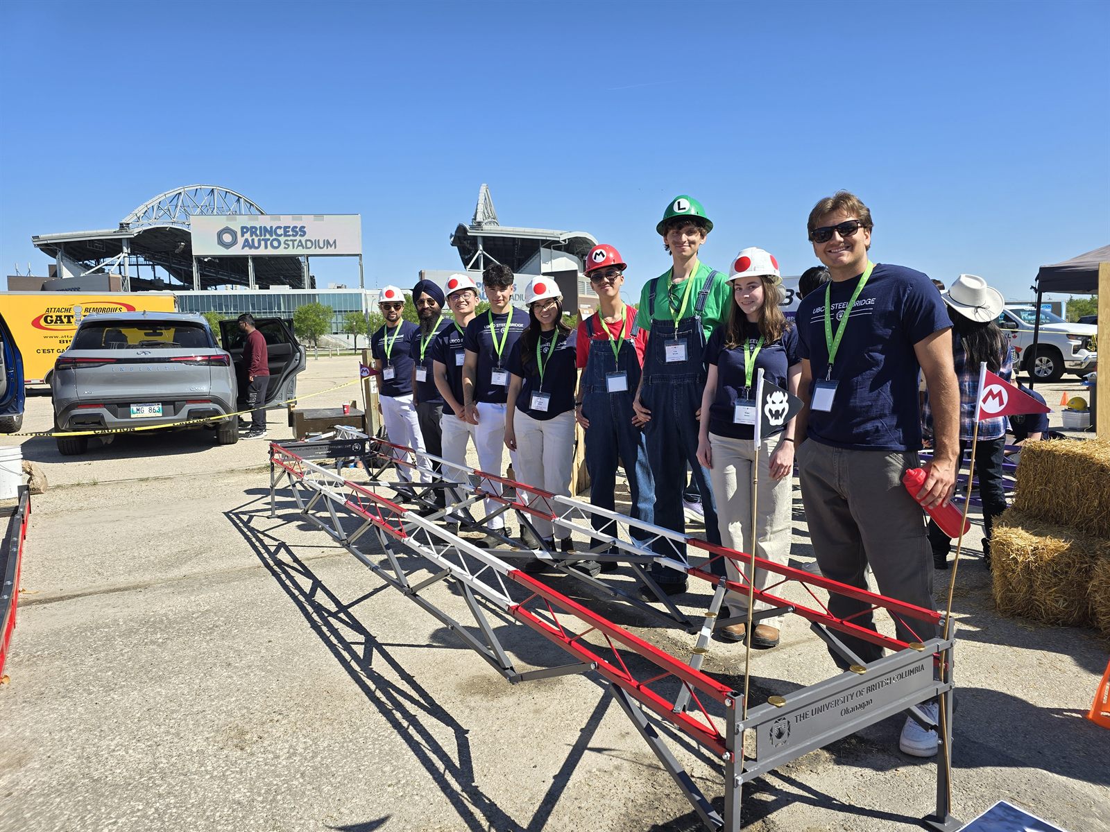The UBCO Steel Bridge team with their first bridge at Princess Auto Stadium in Winnipeg